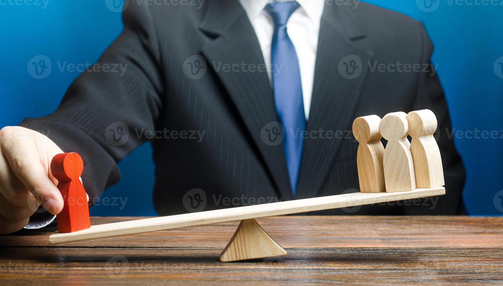 Man opposes red man to group of people on scales. Give a head start. Get an edge advantage. Career growth, nepotism. Leader and valued employee. Inequality of rights. Social significance. photo