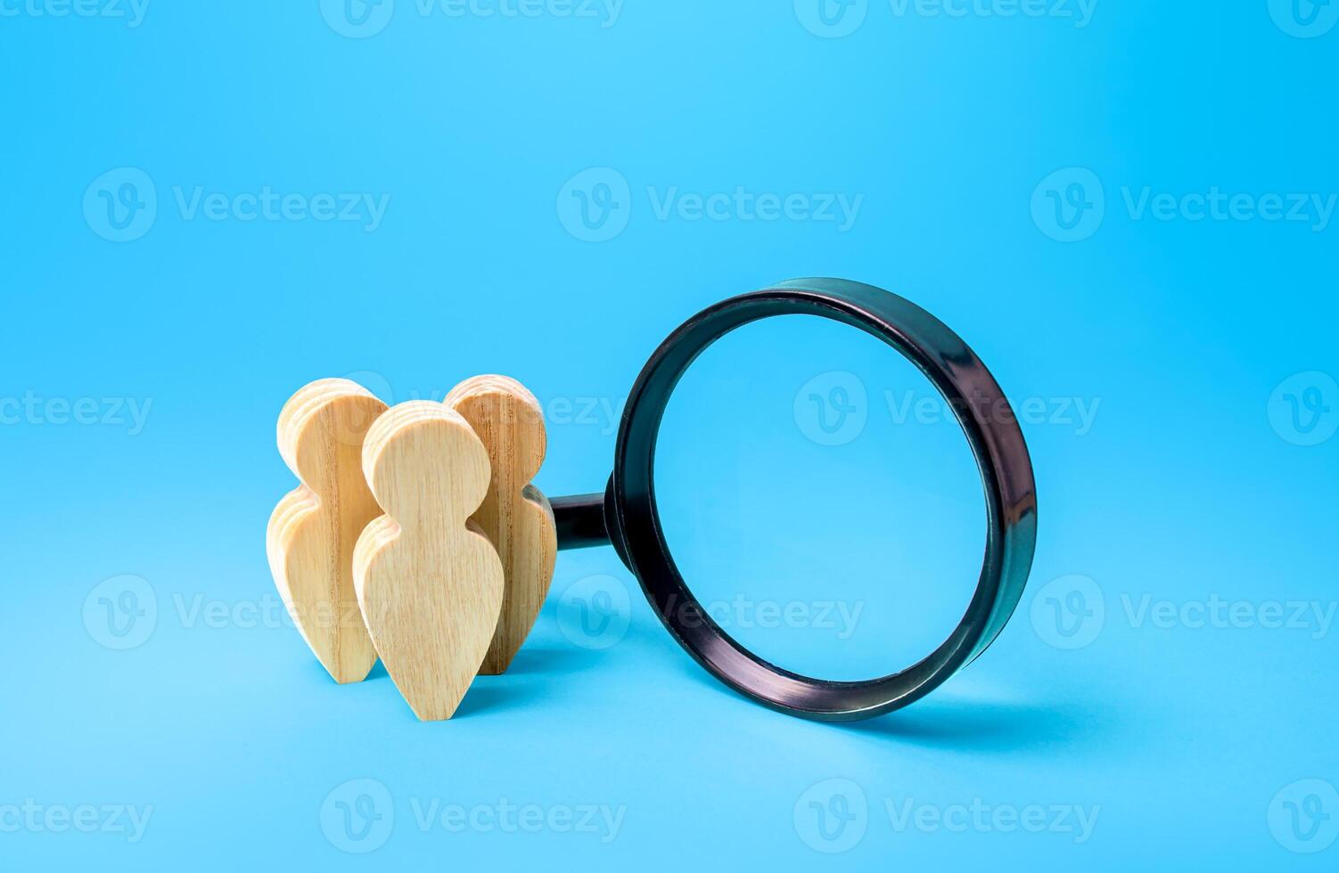 People figures near magnifying glass. Search for new candidates employees, recruiting. Staffing. Human resources. Outsourcing. Dating, searching for people. Social research, marketing. Sociology photo