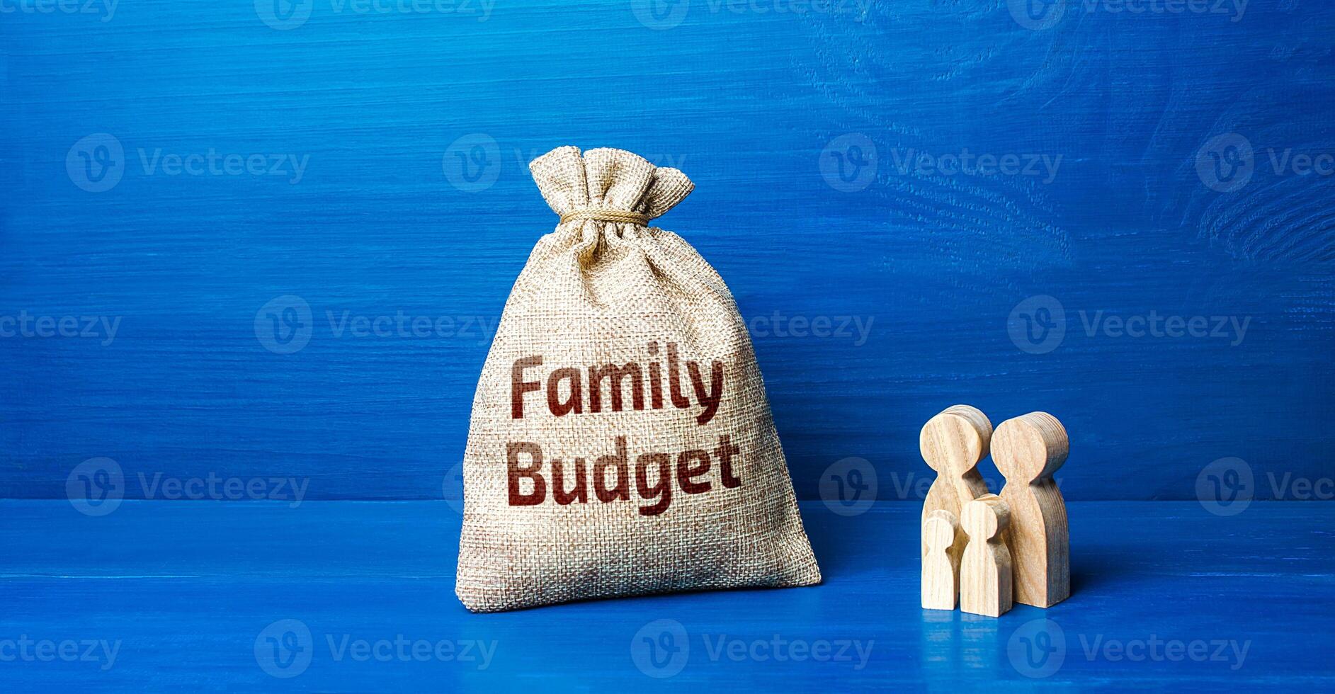 Family figurines and family budget money bag. Security, purchasing power. Financial literacy. Financial support for social institutions. Well-being of the population. Basic income. Cost studies. photo