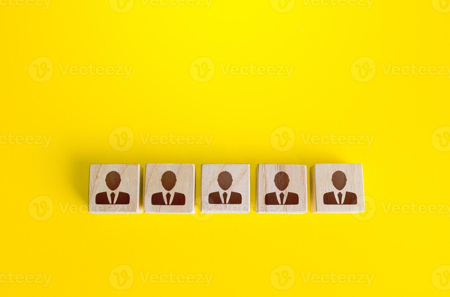 Blocks with employees in a row. Building a business team from many candidates. Personnel management, team formation for a new project. Cooperation and collaboration. Hiring and recruiting workers. photo