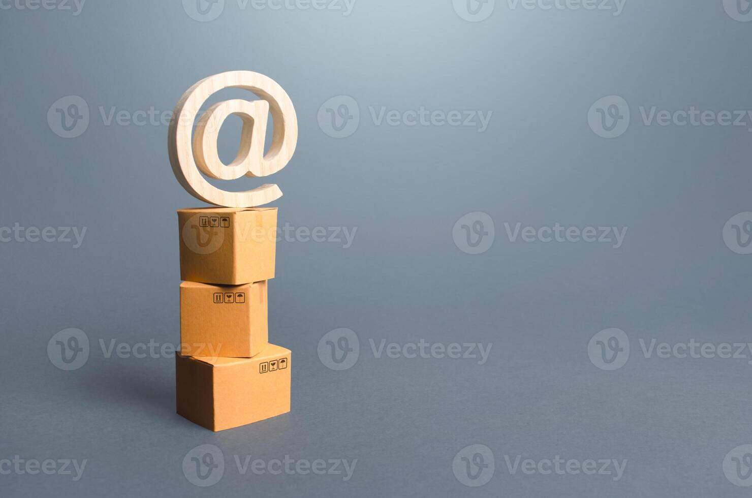 Tower of boxes and email internet symbol. Online Internet distribution of goods. E-commerce. Network marketing advertising. Remote non-contact trade services. Economic reorientation and reformation. photo