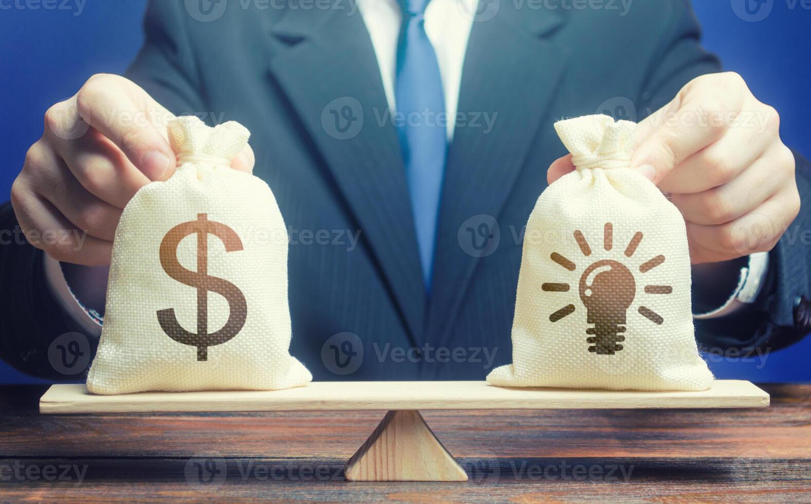 Dollar money bag and ideas patents. Buying a startup. Invest in promising companies, technologies. Stimulating development of innovative business, scientific progress. Educational grants. Brain drain. photo