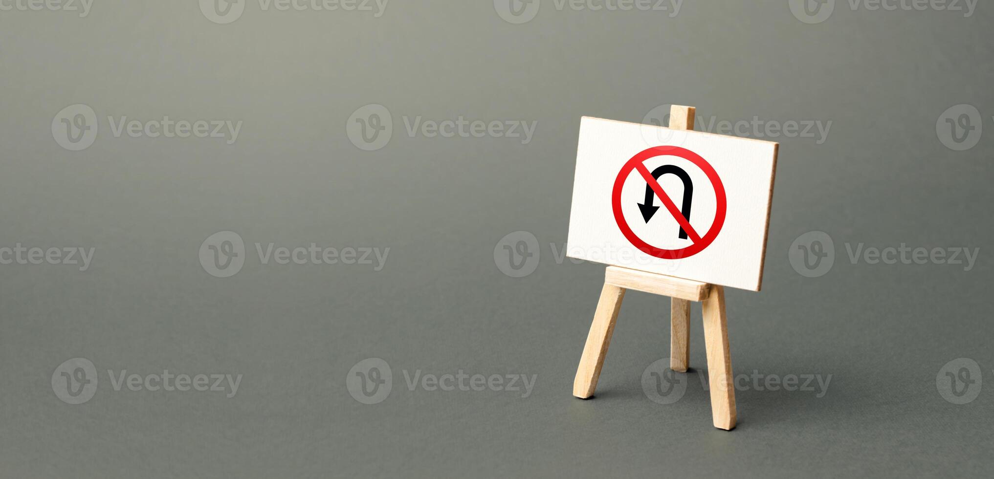 Easel with no turning back traffic sign. Assertiveness and striving, moving forward without retreating. Go to the goal, don't stop. Finish things. No step back photo