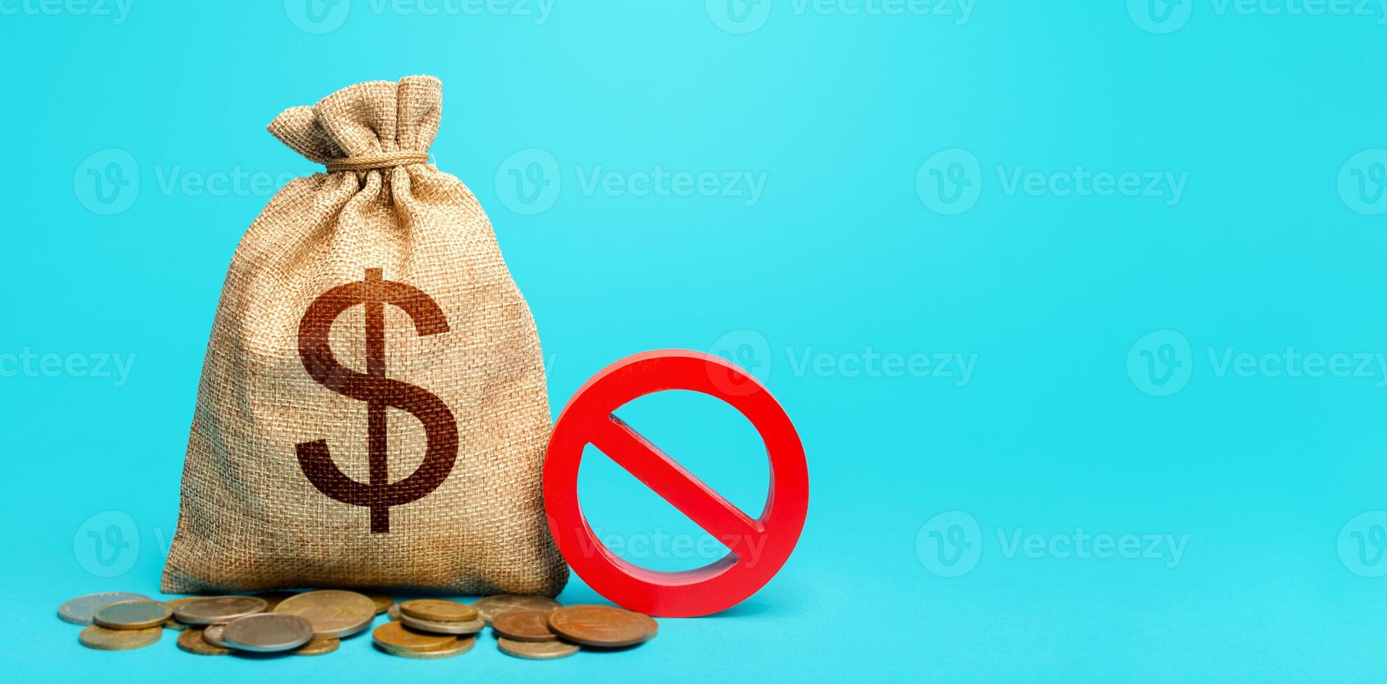 Dollars money bag and red prohibition sign NO. Prohibition on the possession of American currency. Monetary restrictions, freezing and seizure of bank accounts. Forced withdrawal of deposits. photo