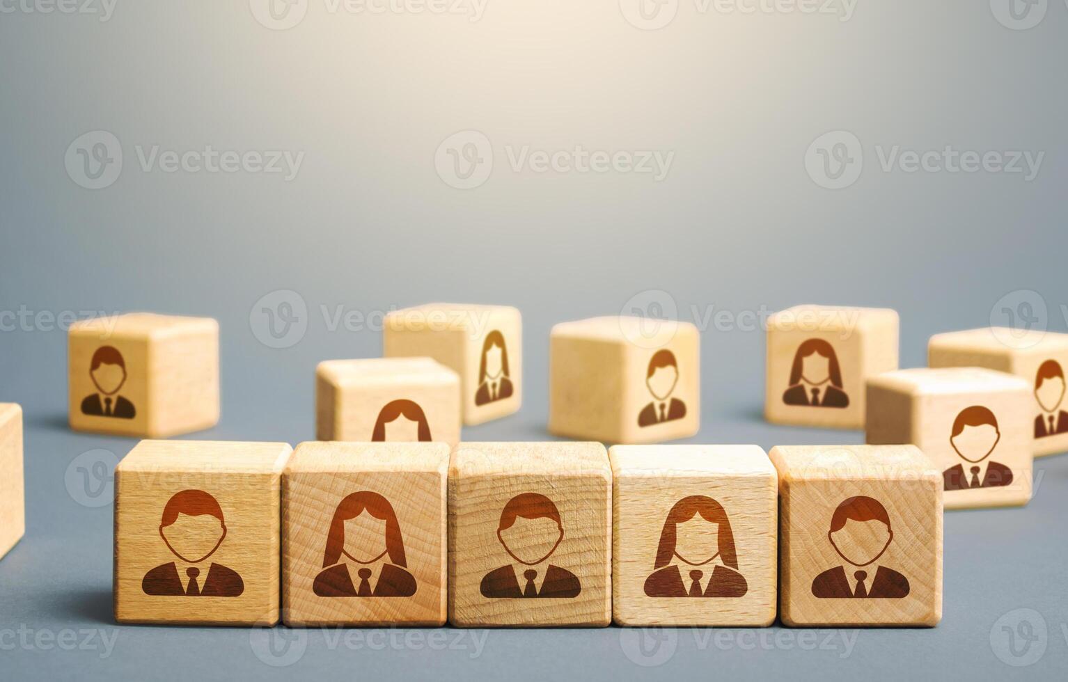 Line of blocks with employees. Building a business team from many candidates. Personnel management, team group formation for a new project. Hiring and recruiting workers. Cooperation and collaboration photo