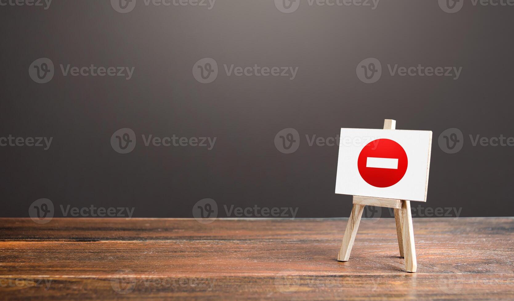 Easel with no entry symbol. Prohibition of actions and operations, restricted area. Ban and sanctions. Isolation zone and quarantine. Wrong direction. Failed strategy. Inaccessibility, taboo. photo