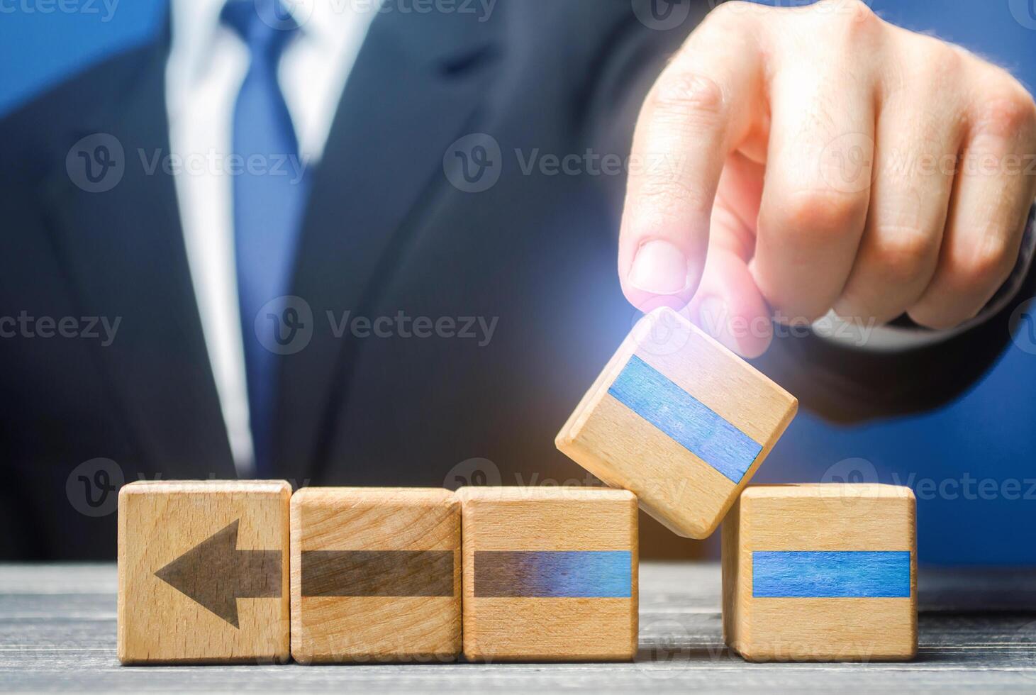 Businessman makes an addition to process to increase its effectiveness. Changes system parameters for high productivity. Integration of improvements, updates and upgrades. Supplementing with new links photo