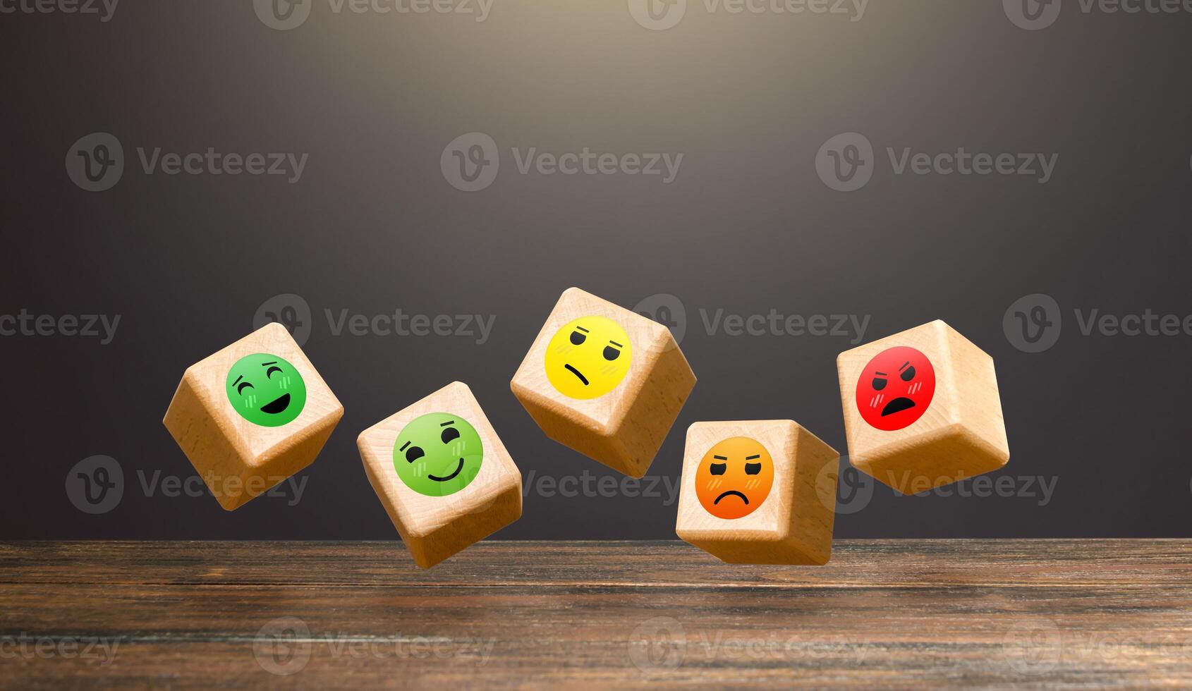 Flying blocks with faces of moods from joy to anger. Conducting a survey. Rating. Approval, indifference, or disagreement. Clients' mood, public opinion. Popularity. Assessment of people's reaction. photo