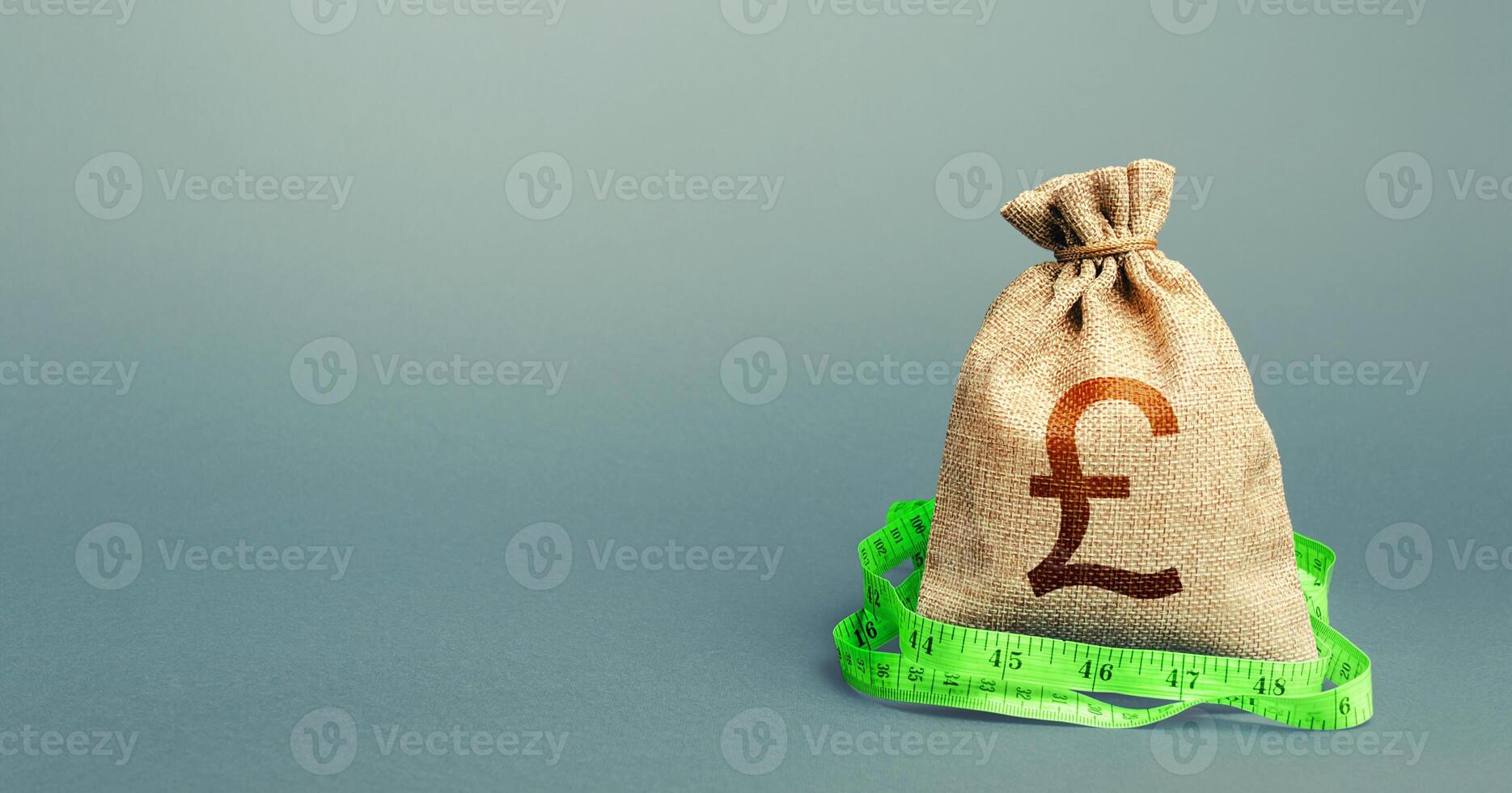 British pound sterling money bag and measuring tape meter. Analysis of economic situation. Formation and optimization of the budget, savings. Assessment of capital. Declaration of income, illegal. photo