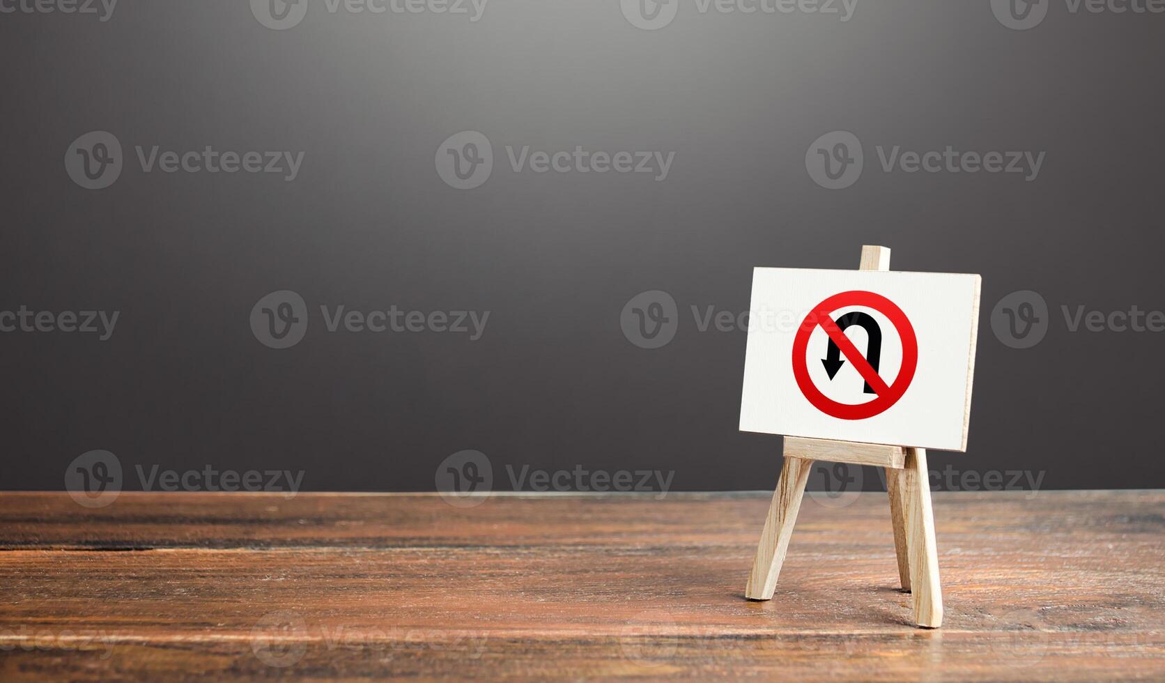 Easel with no turning back traffic sign. Go to the goal, don't stop. Assertiveness and striving, moving forward without retreating. Finish things. There is no way back. Obstinacy and irrevocability photo