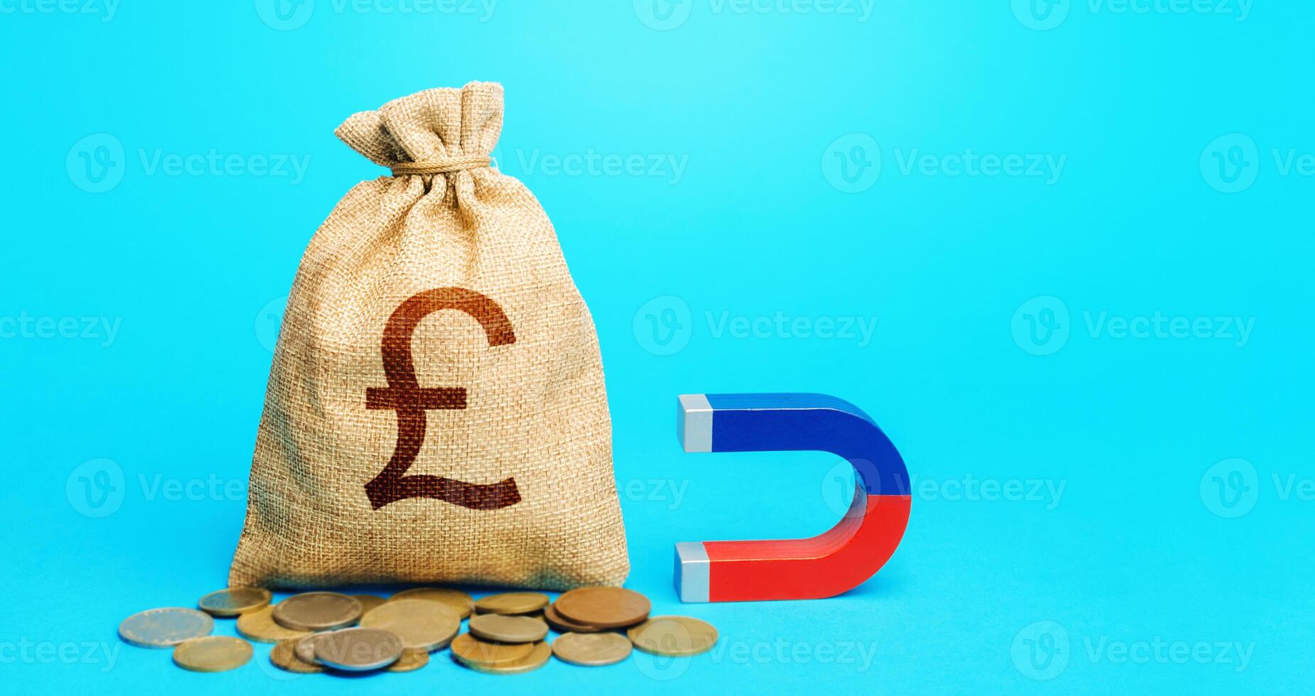 British pound sterling money bag and magnet. Raising funds and investments in business projects and startups. Accumulation and attraction of capital. Money laundering. Tax collection. photo