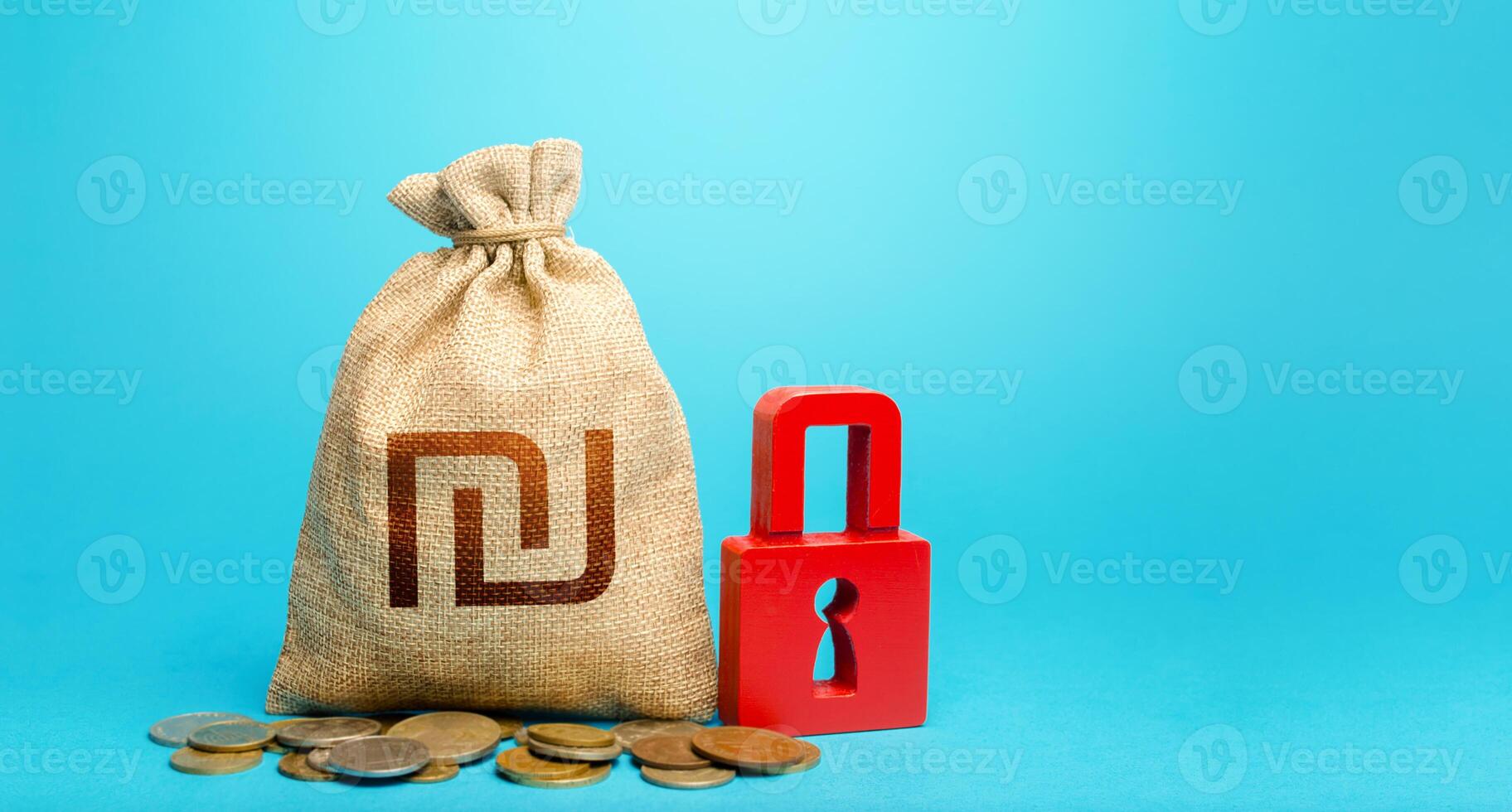 Israeli shekel money bag and red padlock. Tight government control over the financial system. Blocking bank accounts and seizing assets. Cash flow monitoring. Freezing of pension savings. photo