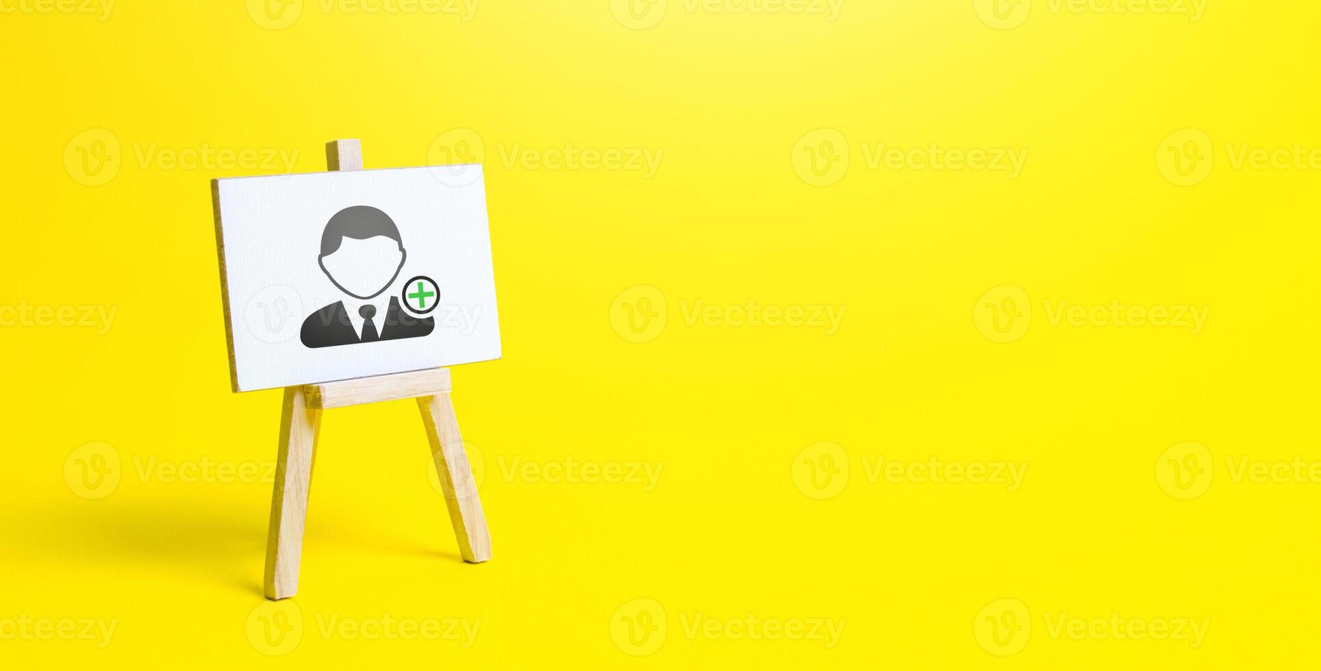 Easel with a new hired employee. Recruiting and HR management. Hiring new workers, staffing. Headhunters and Human Resources. Search for skilled specialists and professionals. Help Wanted photo