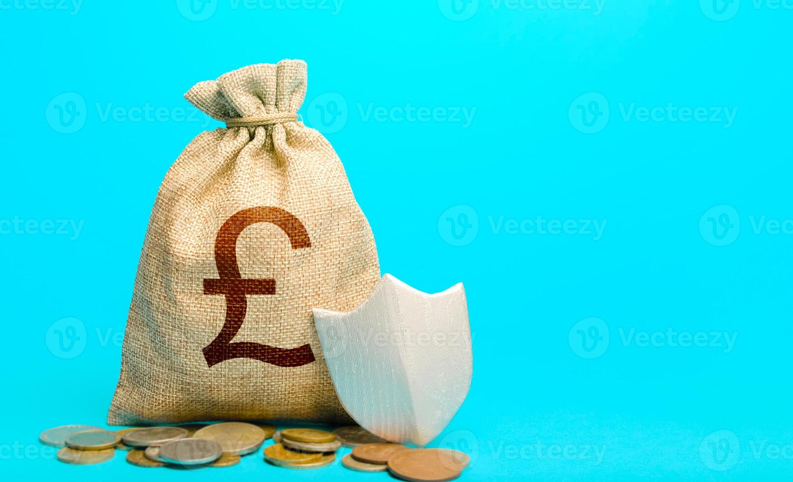 British pound sterling money bag and protection shield. Avoiding loss of funds during inflation. Secured loan. Ease doing business. Financial instruments. Guarantee protection savings and investments. photo