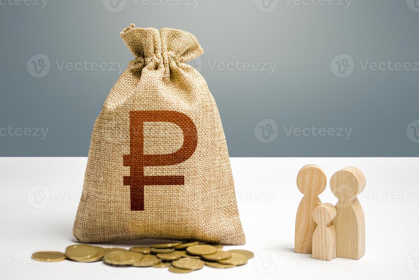 Russian ruble money bag with money and family figurines. Financial support for social institutions. Providing assistance to citizens. Investments in human capital, culture and social projects photo