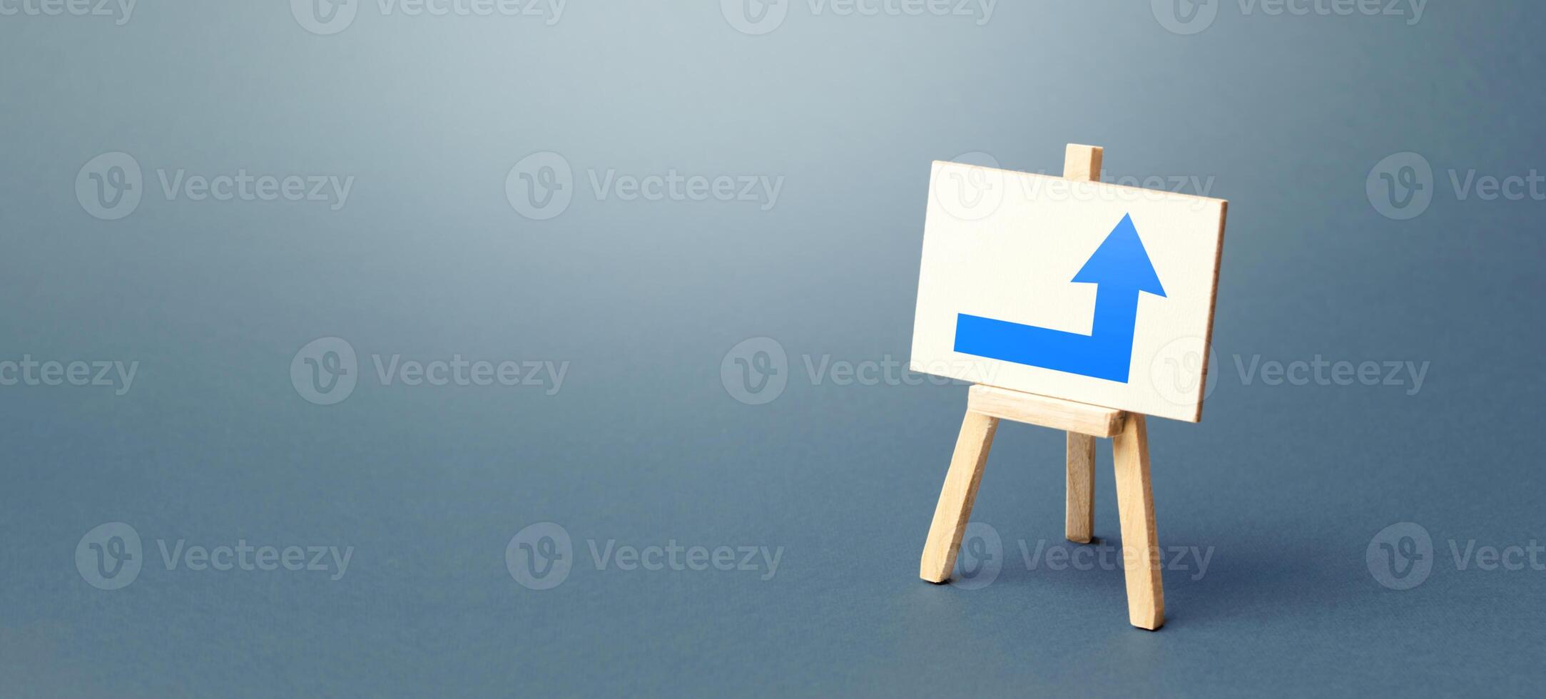 Easel with a blue right arrow. Direction to go around on the right. Advertising, indicating the location of the store object. Minimalism. Navigation, customer acquisition. Copy space photo