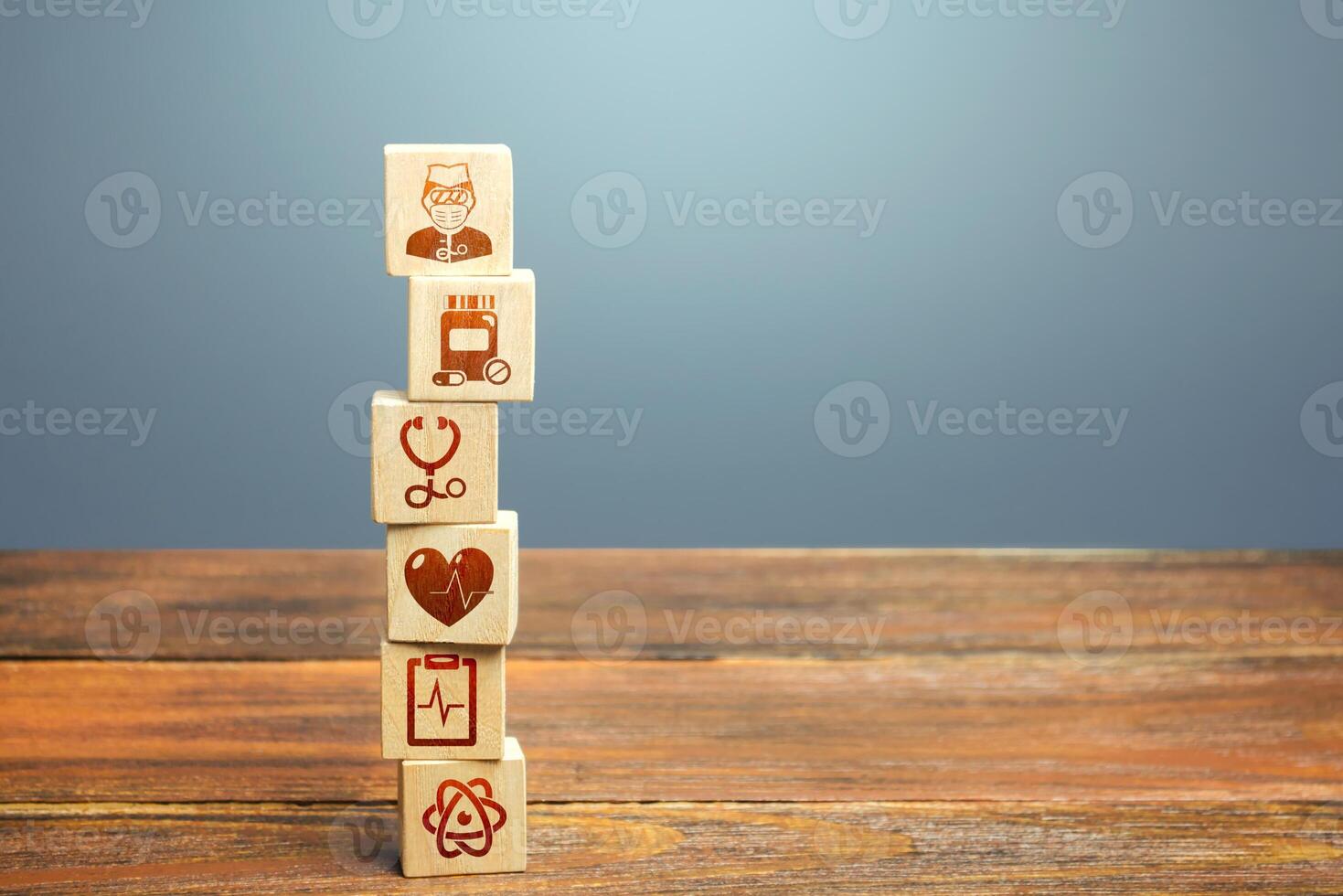 Block tower with medical icons symbols. Healthcare and medical Insurance concept. Supplies, equipment and specialists for the normal functioning of hospitals in the fight against the pandemic. photo