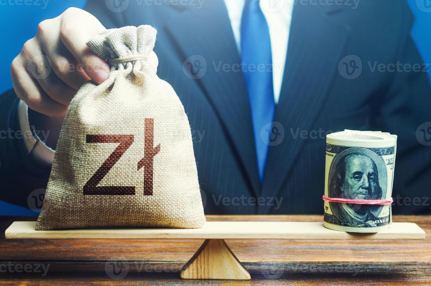 A man puts polish zloty money bag on the scales opposite to the dollar. Investments in foreign currency bonds. Exchange rate, comparison of economic indicators. Protecting savings from inflation. photo