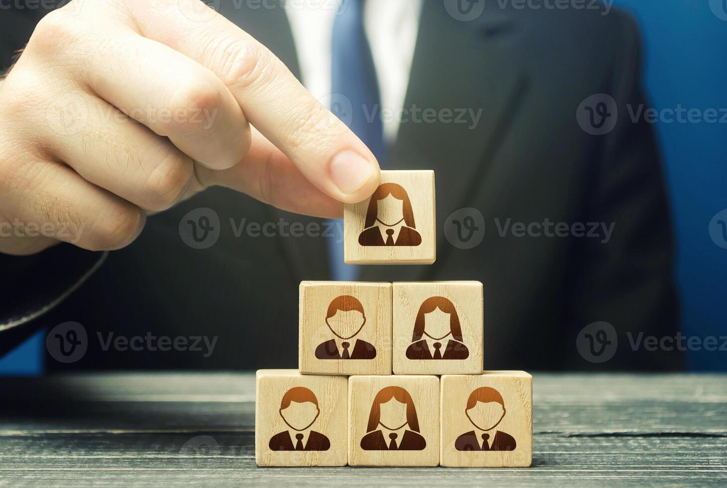 Leader organizes a new business team. Optimal appointment of specialists to suitable posts, creation of an effective business model. Unlocking potential of human capital. Leadership, teamwork photo