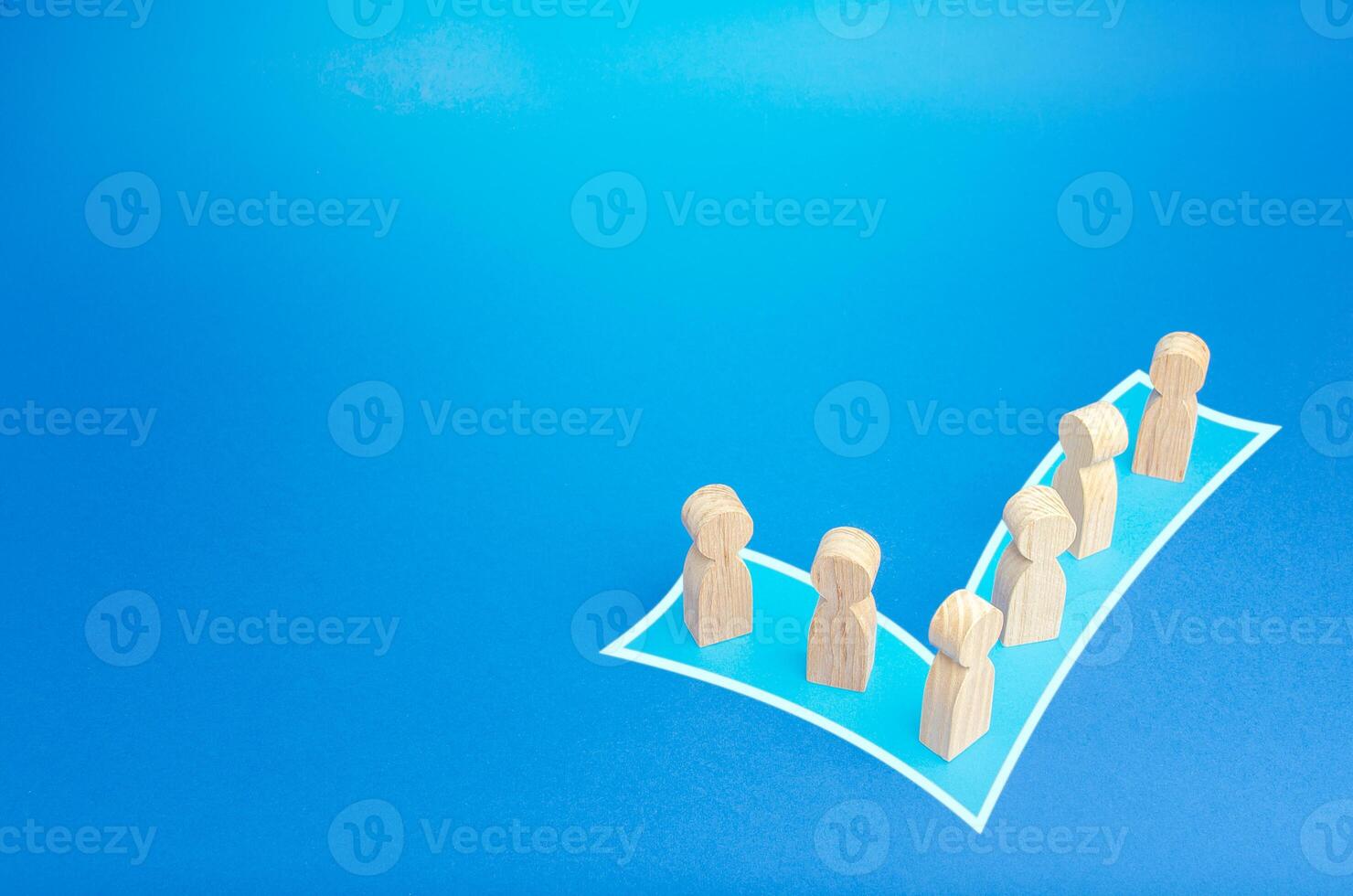 People stand in shape of a checkmark vote. Participate in democratic elections. Unification into a political force of party. Consolidation, cooperation and collaboration. Public social initiative. photo