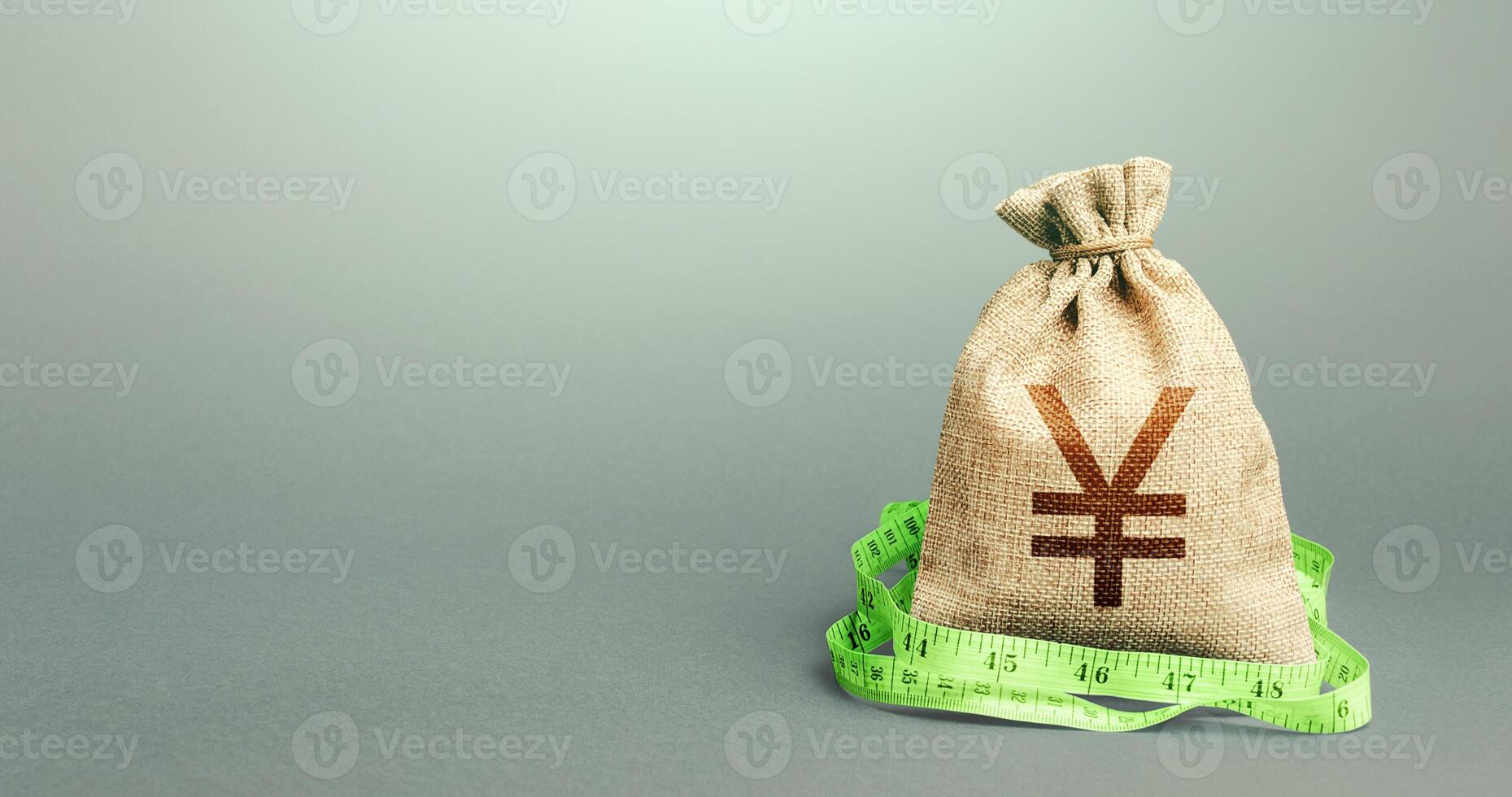 Yen Yuan money bag and measuring tape meter. Analysis of the economic situation. Assessment of capital. Declaration of income, illegal enrichment. Formation and optimization of the budget, savings. photo
