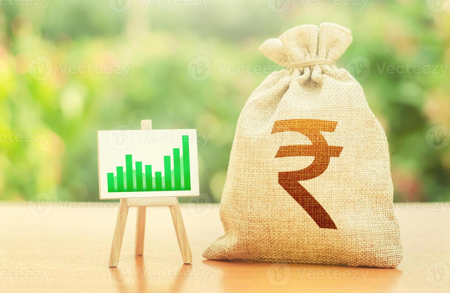 Indian rupee money bag and easel with green positive growth graph. Economic development. Business sentiment. High deposits profitability. Recovery and growth of economy, good investment attractiveness photo