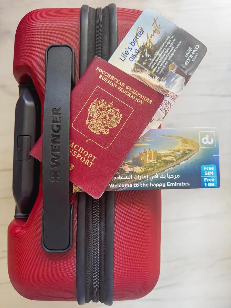 Dubai, UAE - May 28, 2024 Russian passport and communication package sim card 5G in Dubai photo