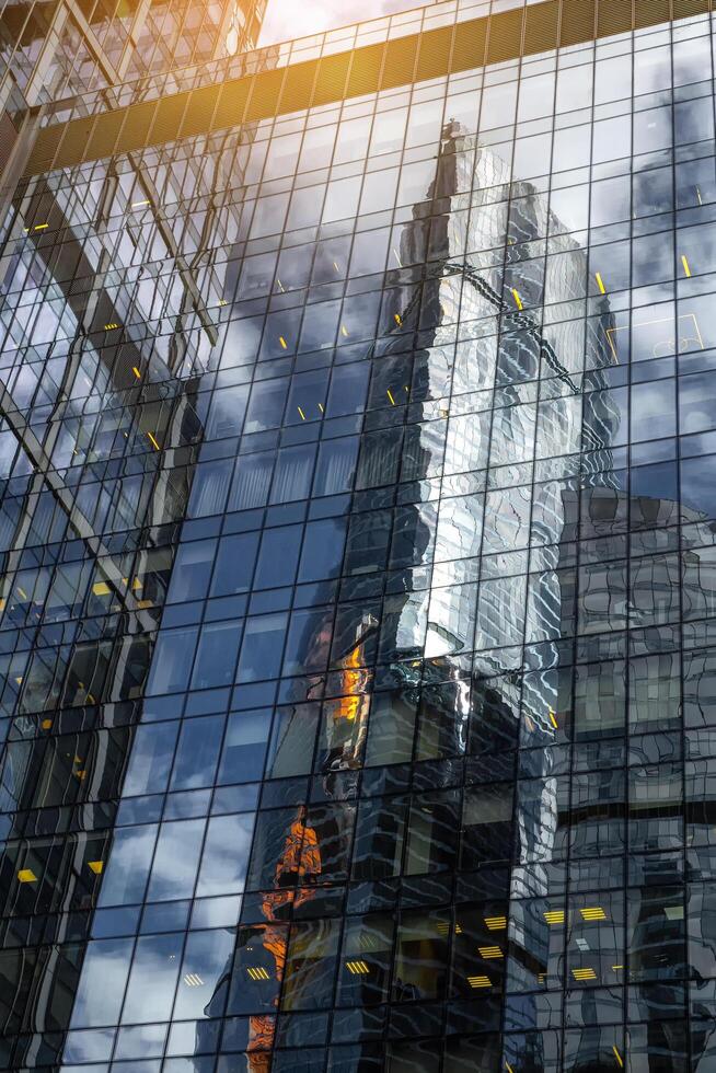 Moscow - July 31,2020 Blurred abstraction. Abstract reflection of geometric shapes with a glass building photo