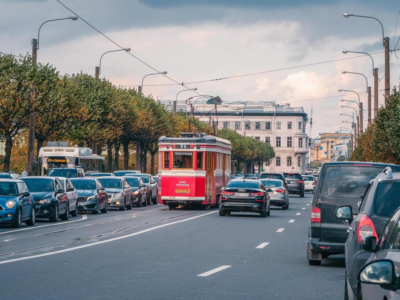 Saint Petersburg, Russia, September 30, 2020 Tourist tram in city traffic. photo