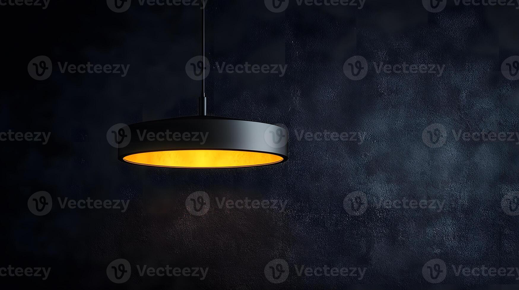 Minimalist pendant lamp creating dramatic spotlight effect against black wall, showcasing industrial design with warm light glow in contemporary interior setting. wall photo