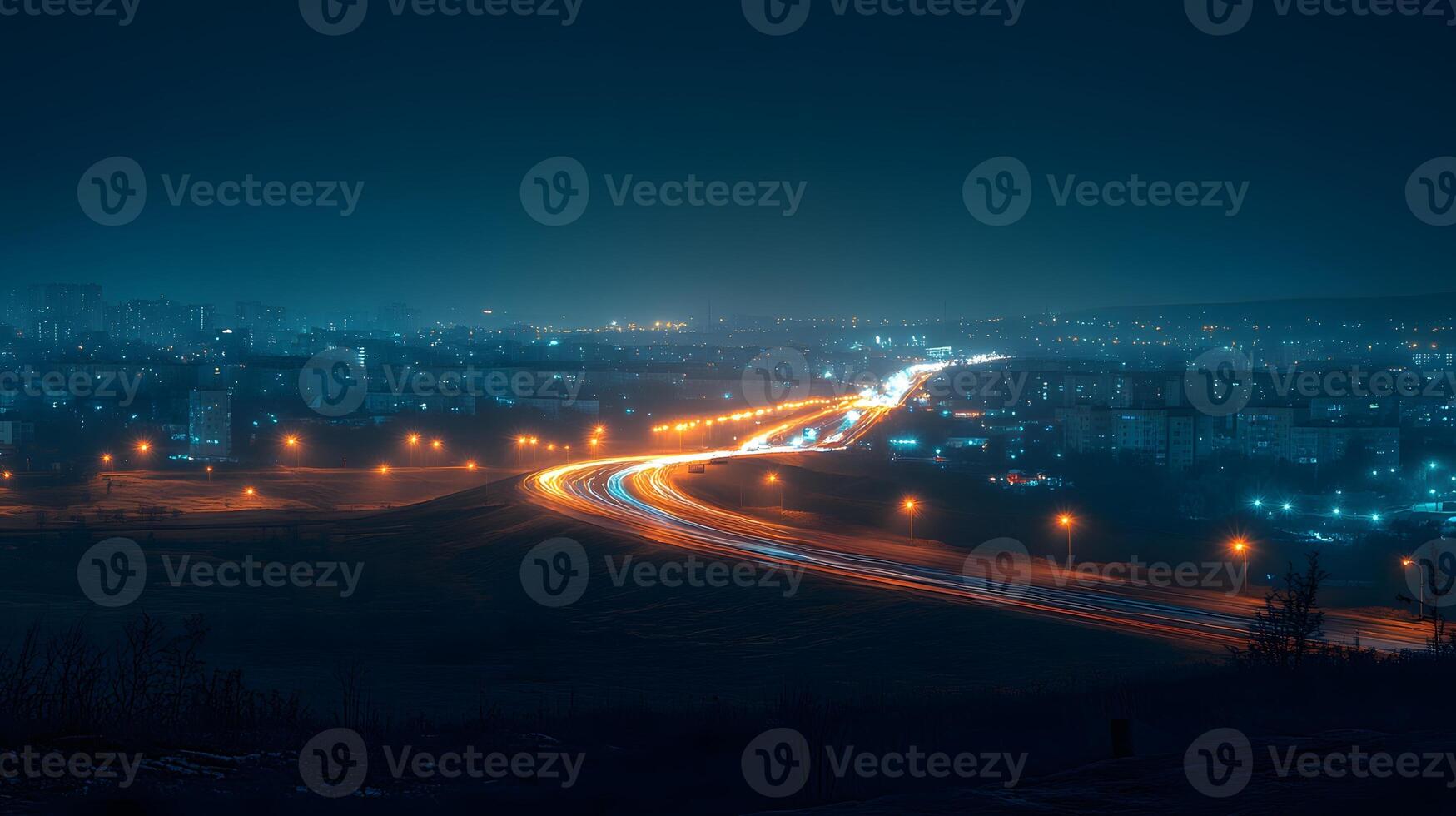 Night highway captures flowing light trails from cars in long exposure, creating glowing streaks against dark sky with urban silhouette and neon color effects. metropolitan photo