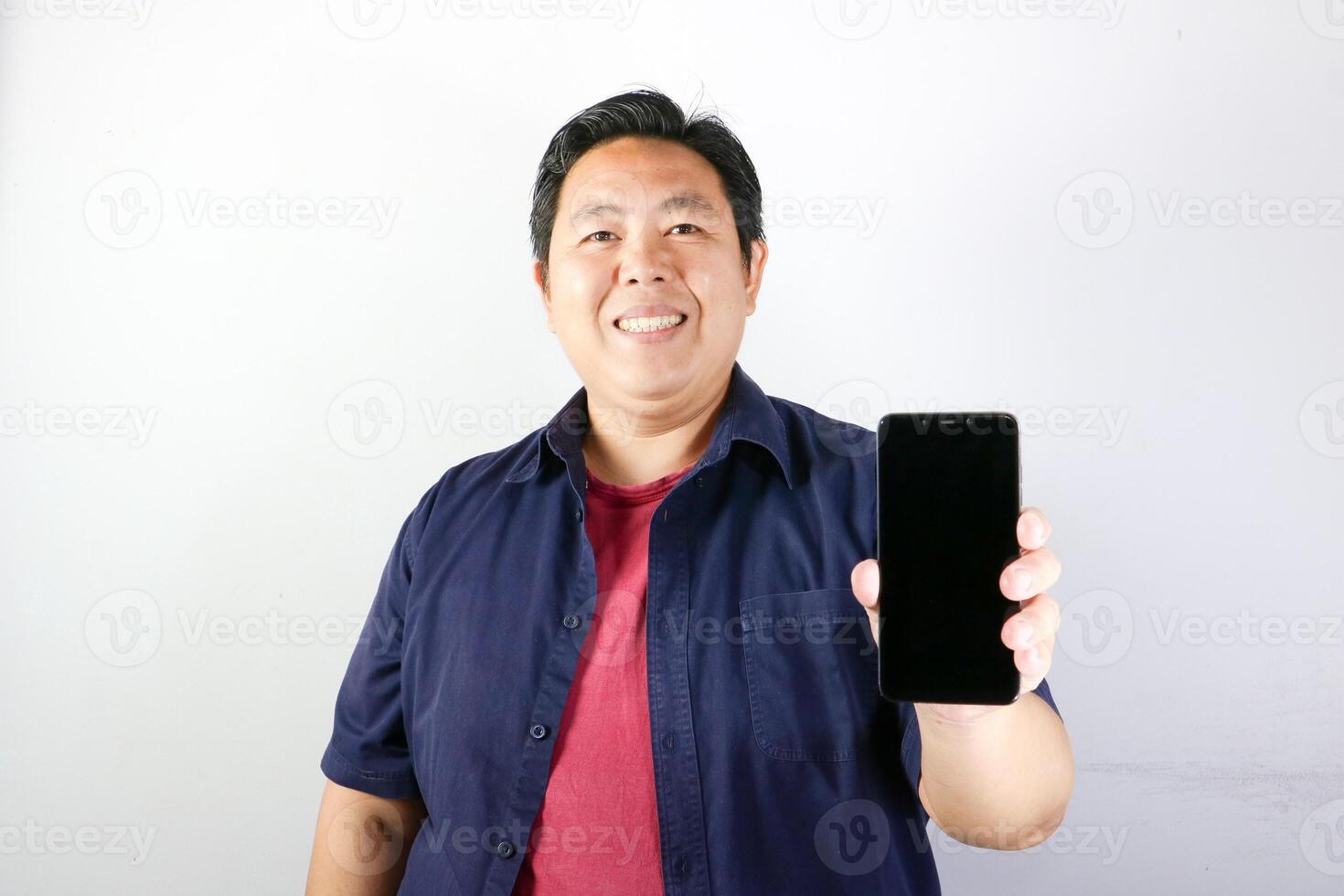 Smiling Man with showing blank screen his smartphone, Communication and technology concept. photo