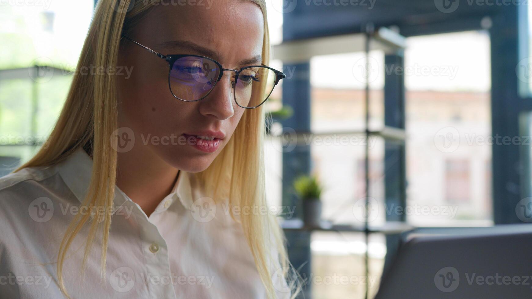 Caucasian female business girl manager worker ceo executive businesswoman at office desk focused woman working typing project on laptop computer online work project startup chatting with clients email photo