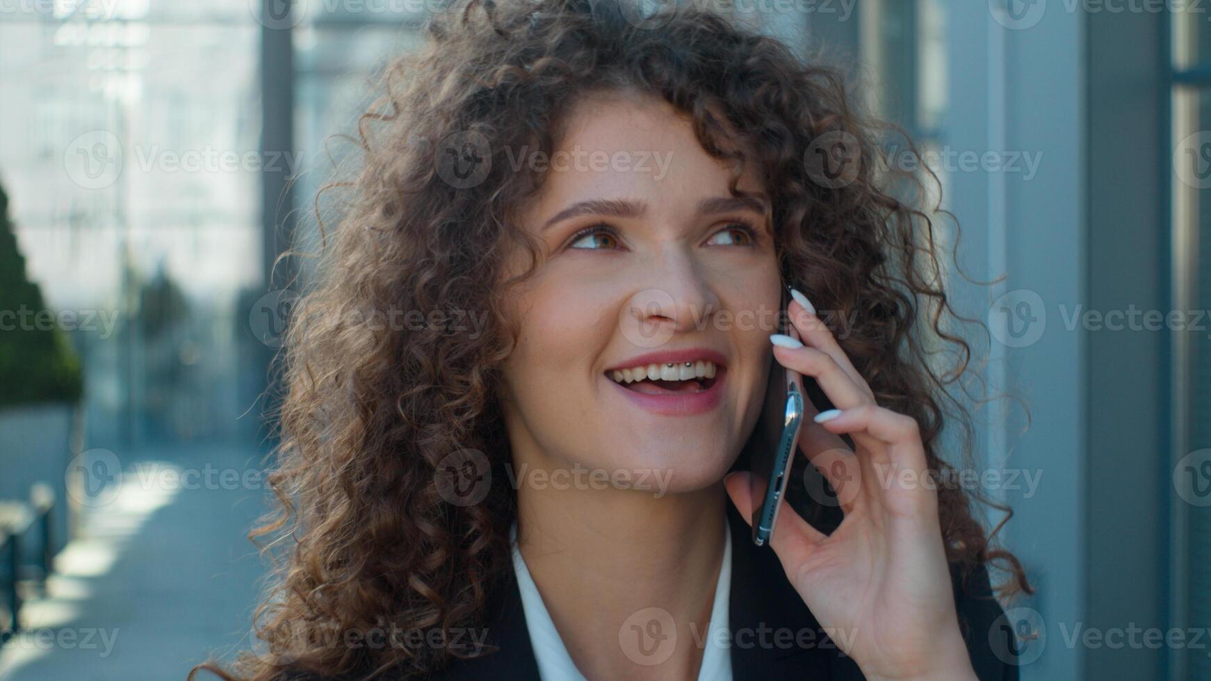 Smiling Caucasian woman business girl walking city street with smartphone young businesswoman call to colleague mobile conversation female employer lady talking phone communication outdoors downtown photo