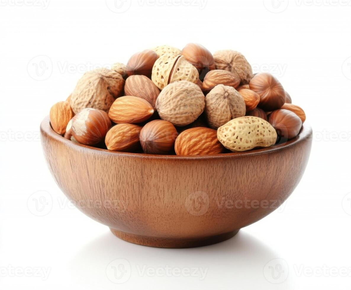 Various nuts arranged in a wooden bowl showcasing their natural textures and hues for healthy snacking photo