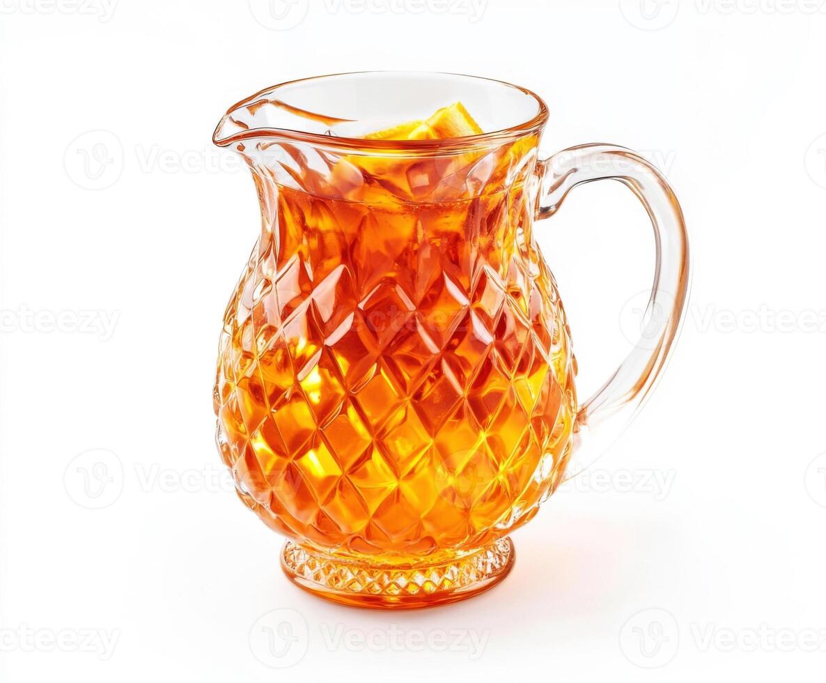 Clear glass pitcher filled with refreshing iced tea ready for a summer picnic or gathering photo