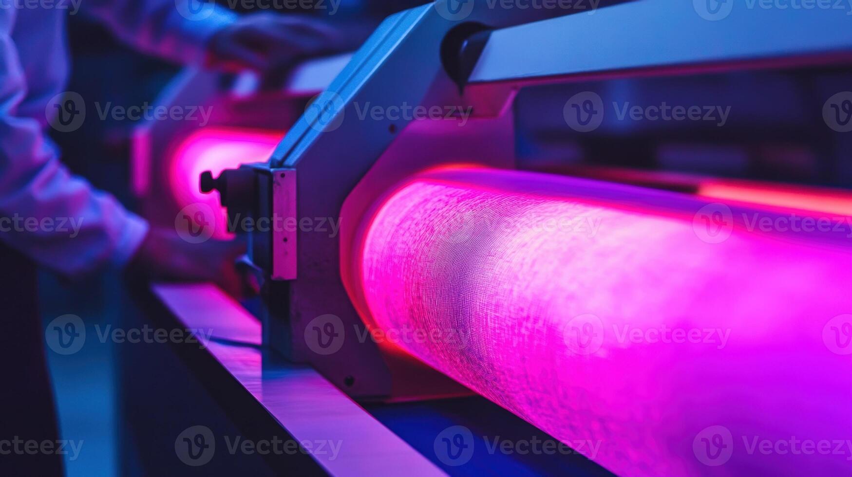 An operator scrutinizes a roll of fabric under powerful LED lights with a color spectrometer analyzing color consistency highlighting the meticulous process of quality assurance i photo