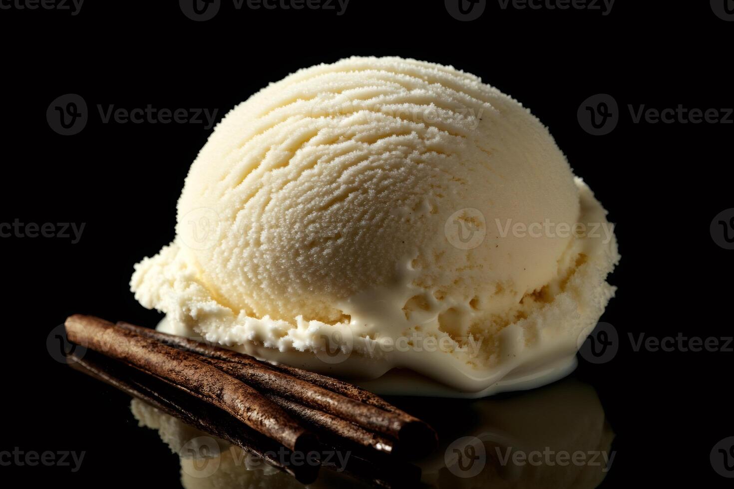Vanilla ice cream scoop melting with cinnamon sticks on black background photo