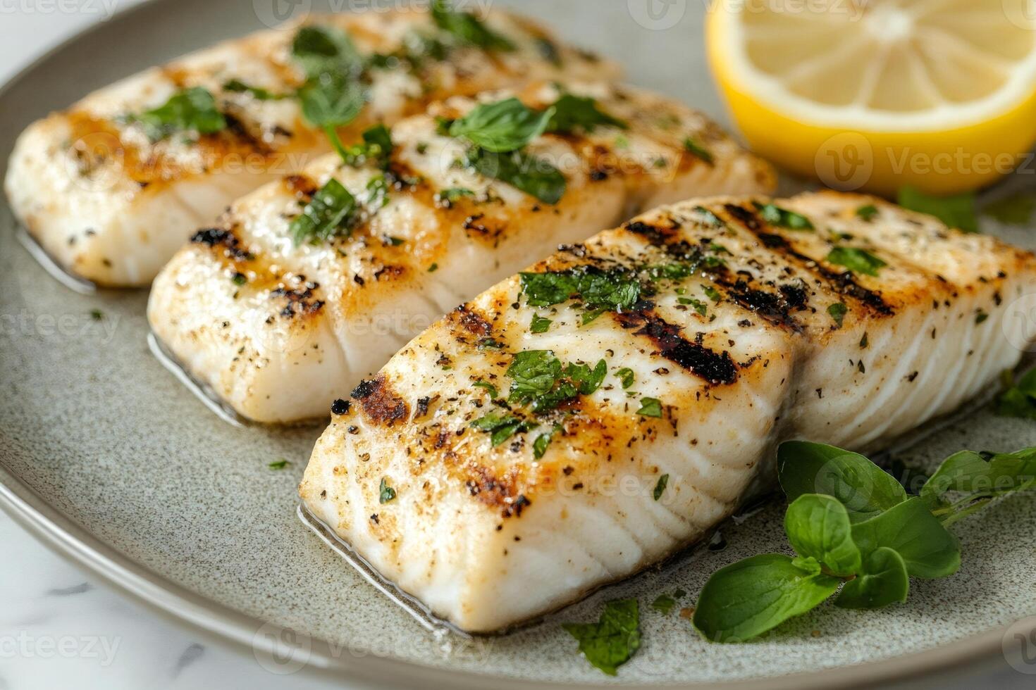 Grilled halibut fillets with herbs and lemon healthy and delicious seafood dish photo