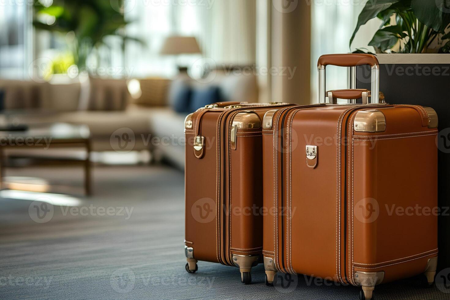 Two elegant leather suitcases waiting in hotel lobby for luxurious vacation photo