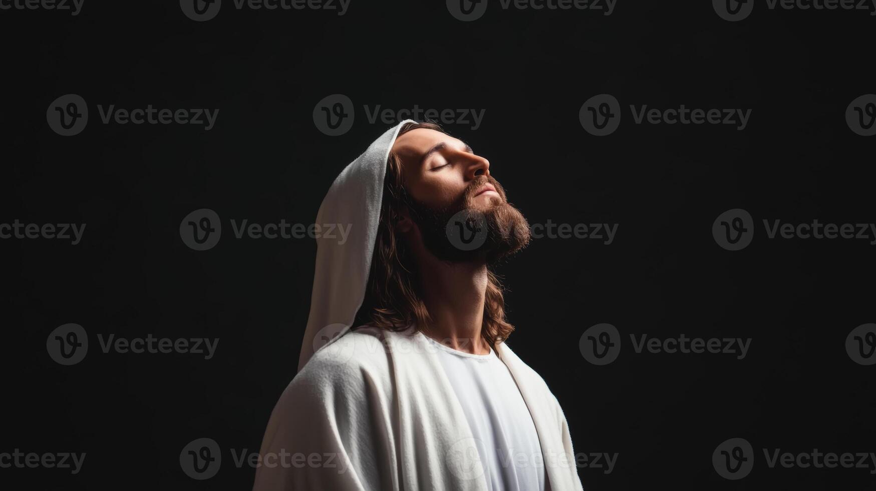 Spiritual figure Jesus Christ with serene expression gazes upward against dark background during quiet moment of reflection photo