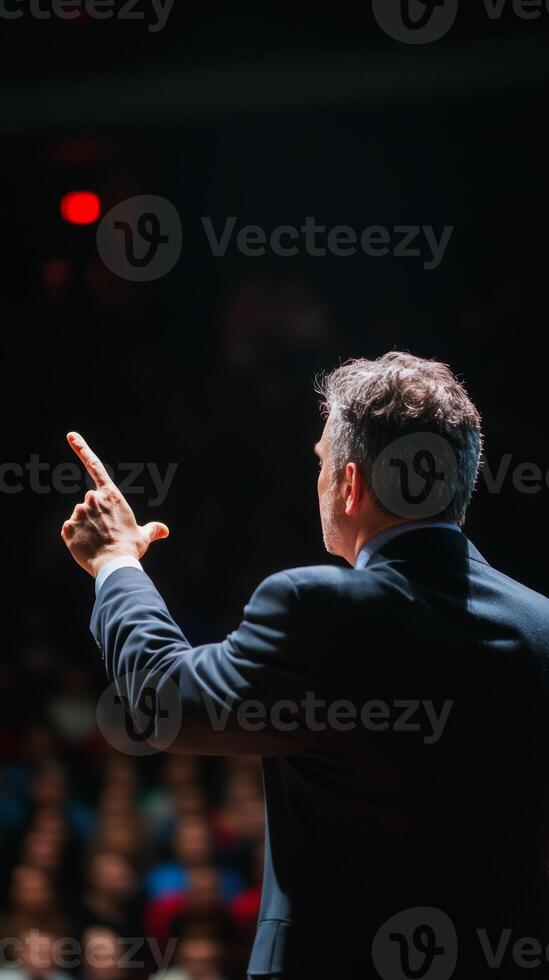 Speaker engages audience with dynamic gesture during a presentation in a modern venue photo