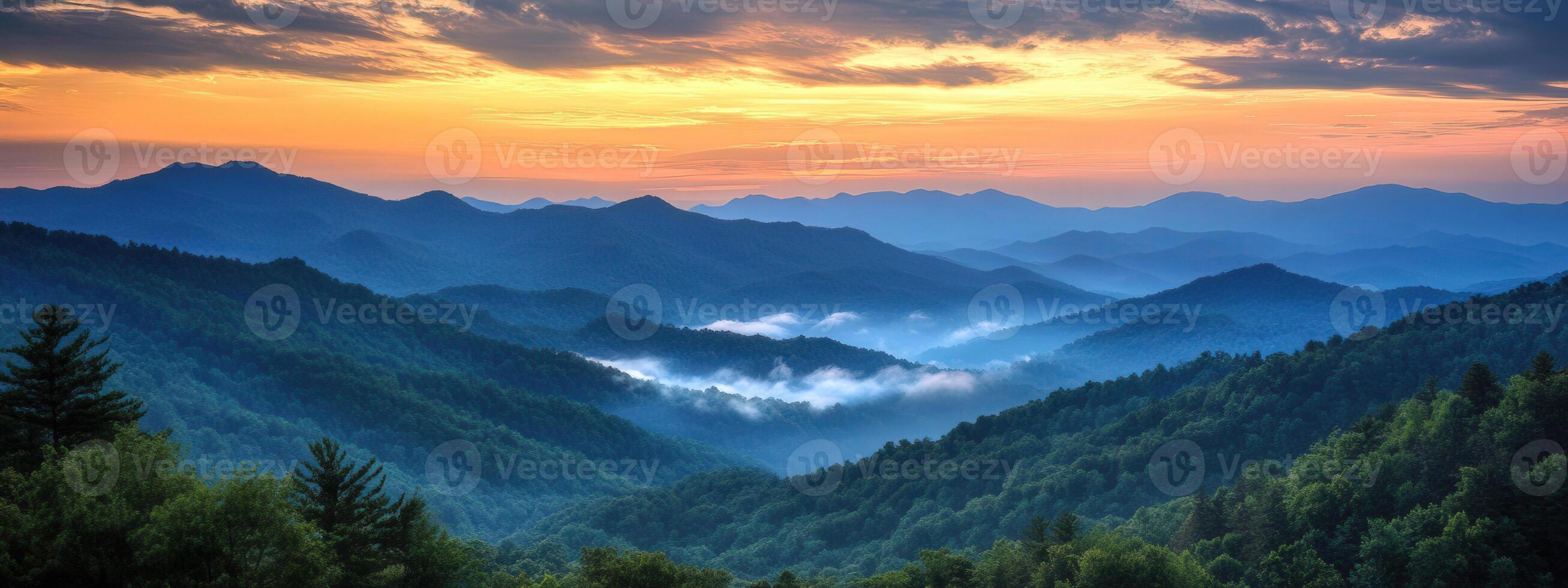 a beautiful view of mountains and trees at sunset photo