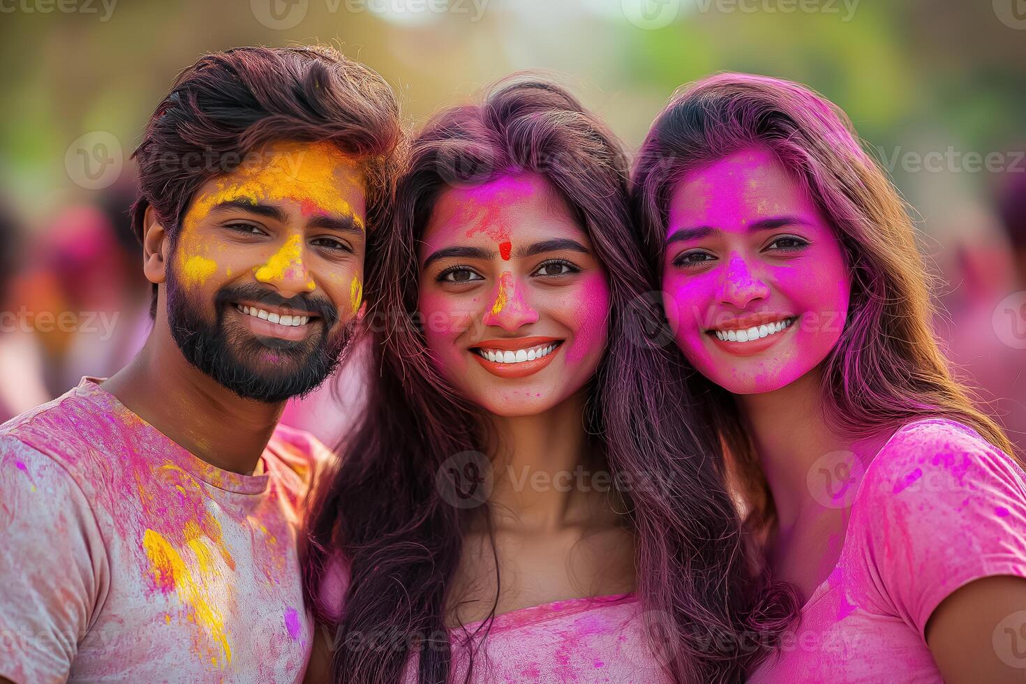 three young people with pink paint on their faces photo