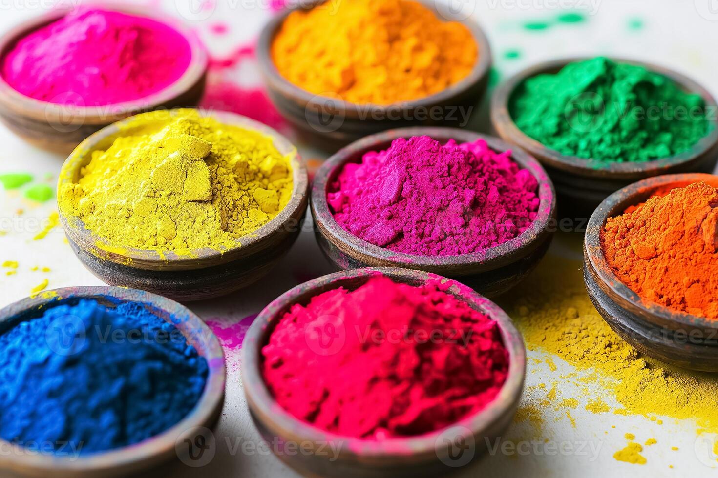 bright powders arranged neatly on a rustic wooden surface with ethnic designs photo