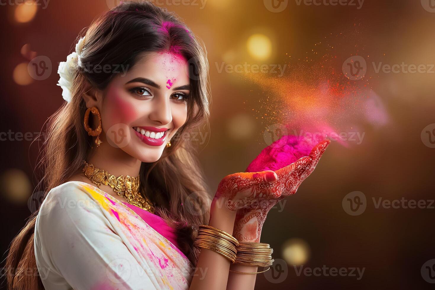 happy indian woman with holi powder in her hands photo