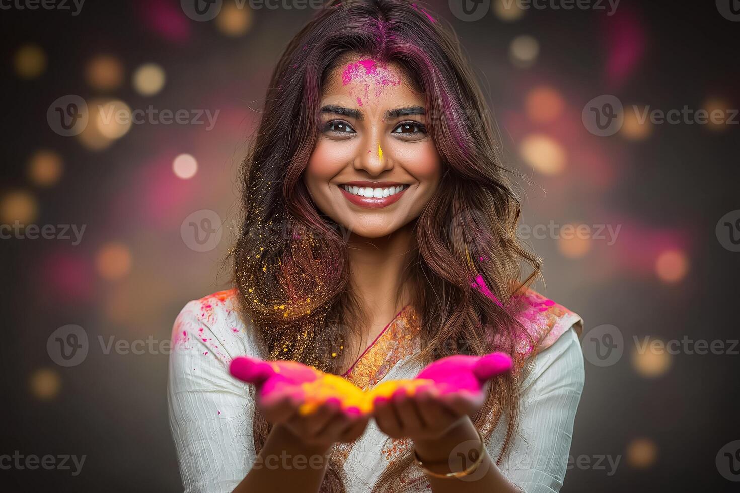 happy woman with holi powder in her hands photo