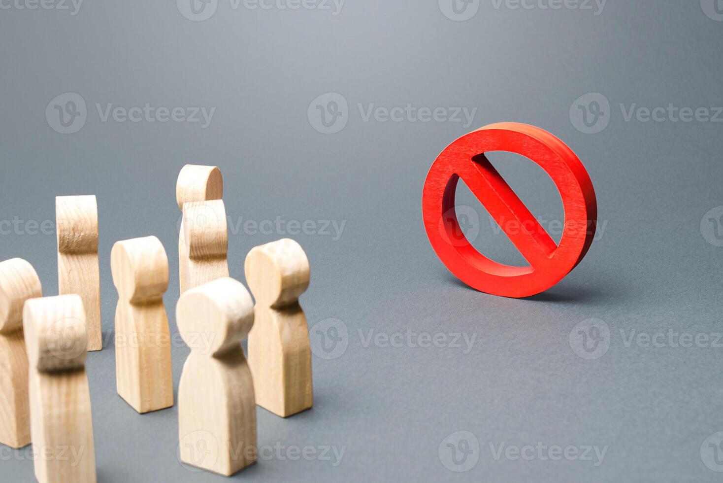 People look at red prohibition sign NO. Restriction of rights and freedoms, legislative prohibition laws and rules. Taboo, rejection. Abolition of restrictive measures under society pressure. photo