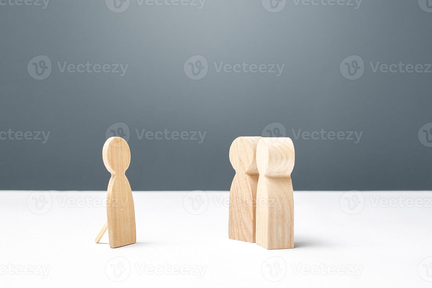 Two persons looking at a false human figure. Unreliability, deceit and fraud. Unworthy of trust and confusing people around. Communication difficulties, Absence. a Dummy. photo