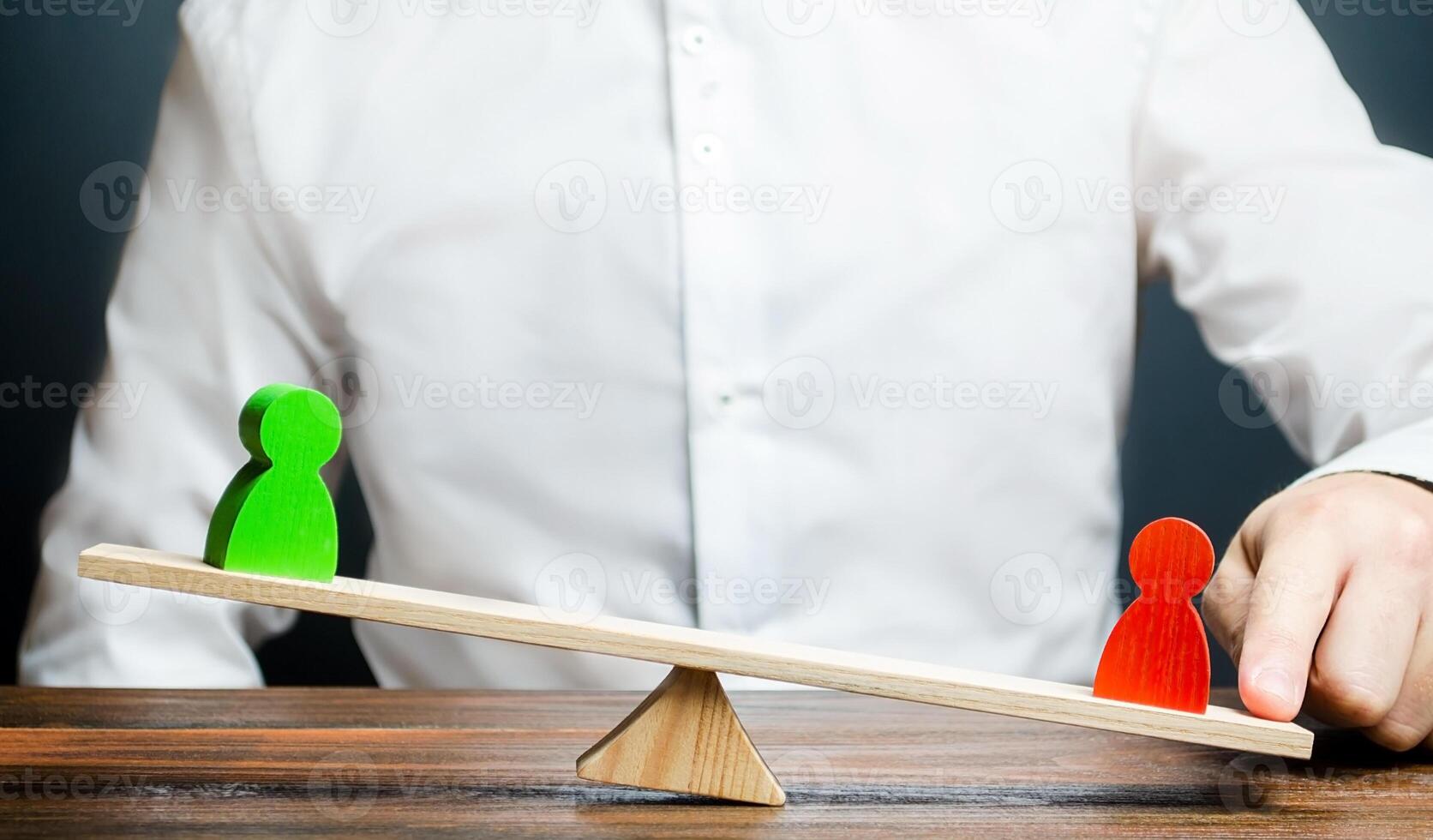 A man takes the side of a red figure in a dispute. Mediator and arbiter. Losing a conflict, gaining an opponent an advantage. Corruption and violation of laws and justice. Fail. Collusion photo